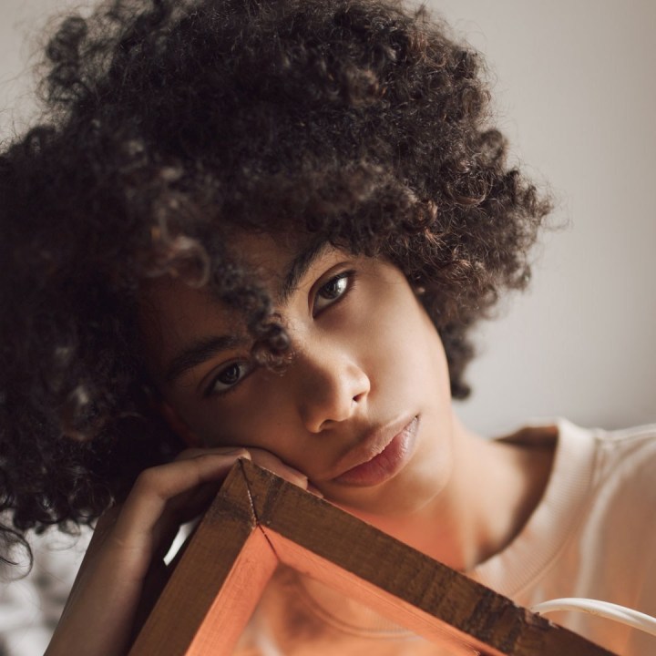 afro caribbean reader smiling